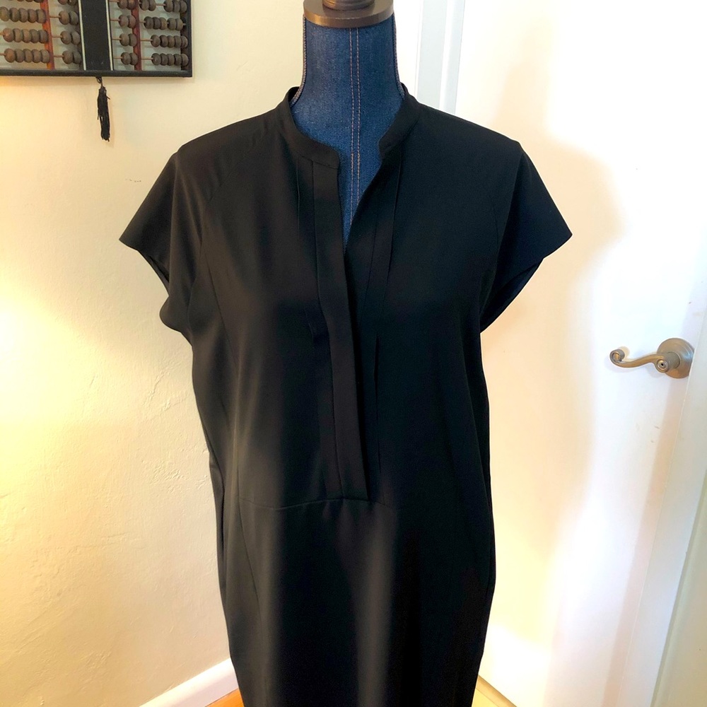 Woman’s black dress by Vince